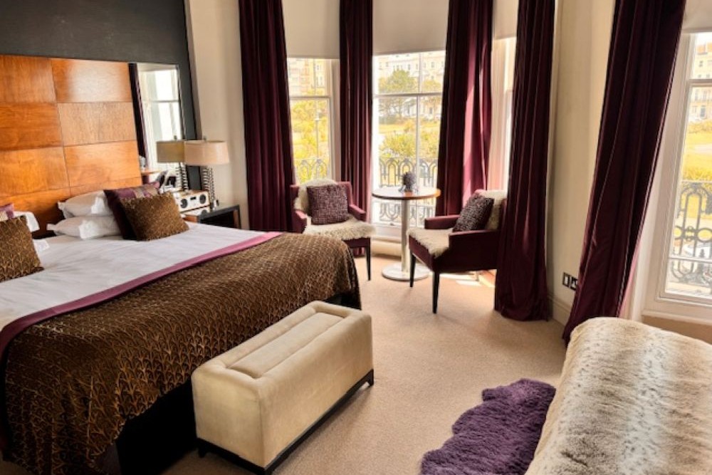 Hastings House Bedroom 3 — walnut headboard, sea views